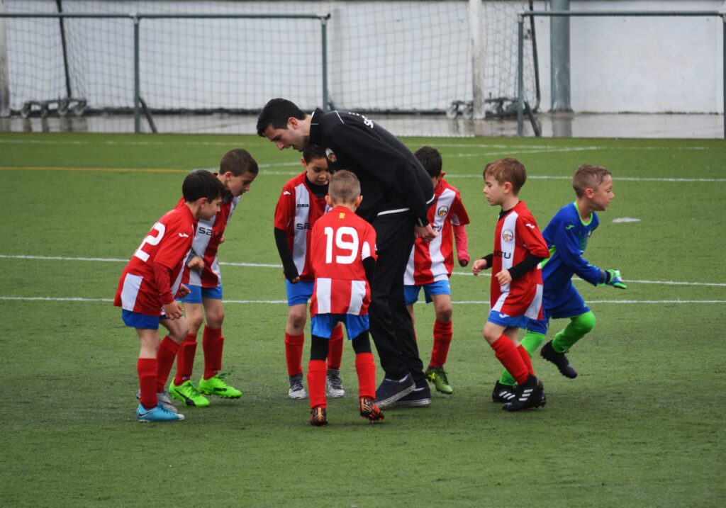 a soccer coach training kids